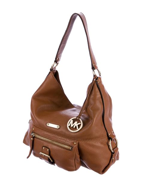 is michael kors bags real leather|genuine leather michael kors purses.